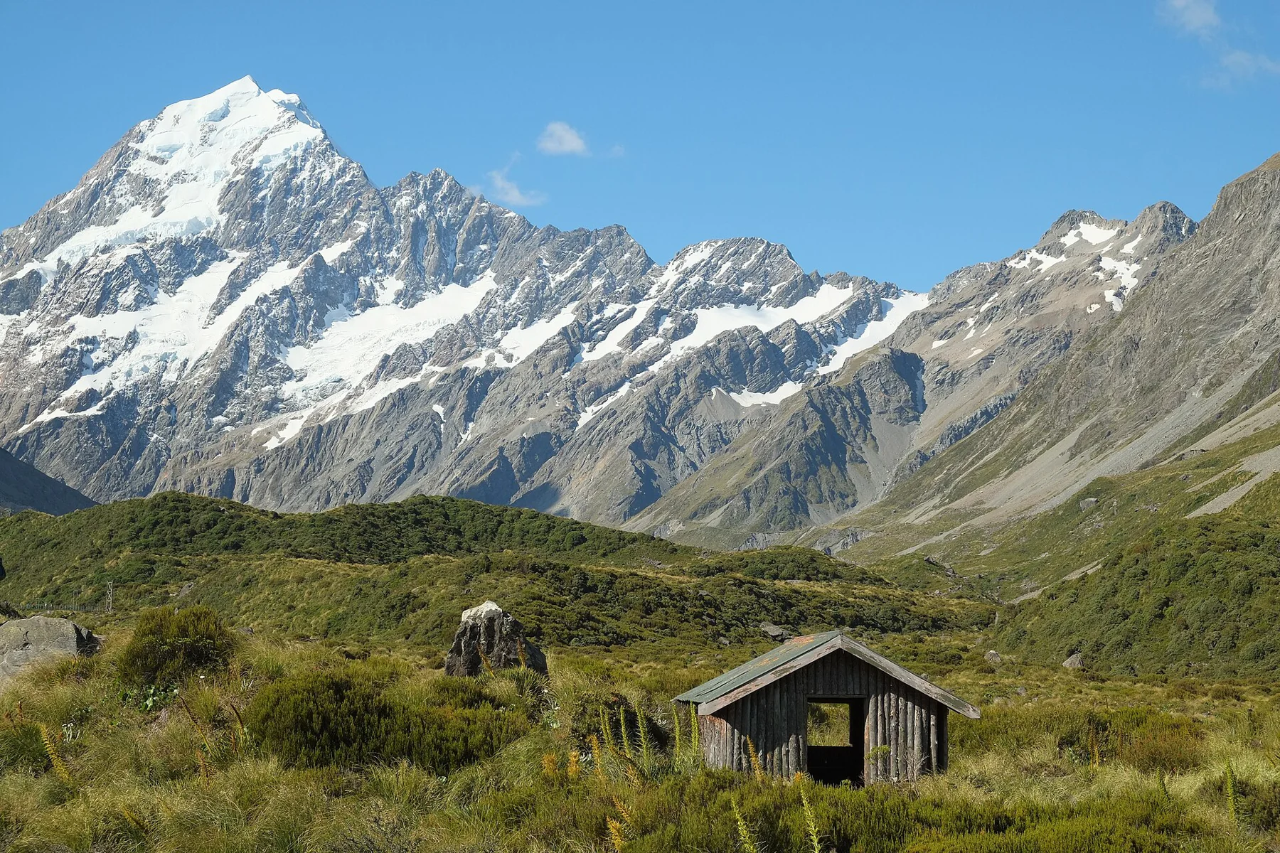 Stocking Stream Shelter in the Hooker Valley beneath the Aoraki / Mount Cook Range.