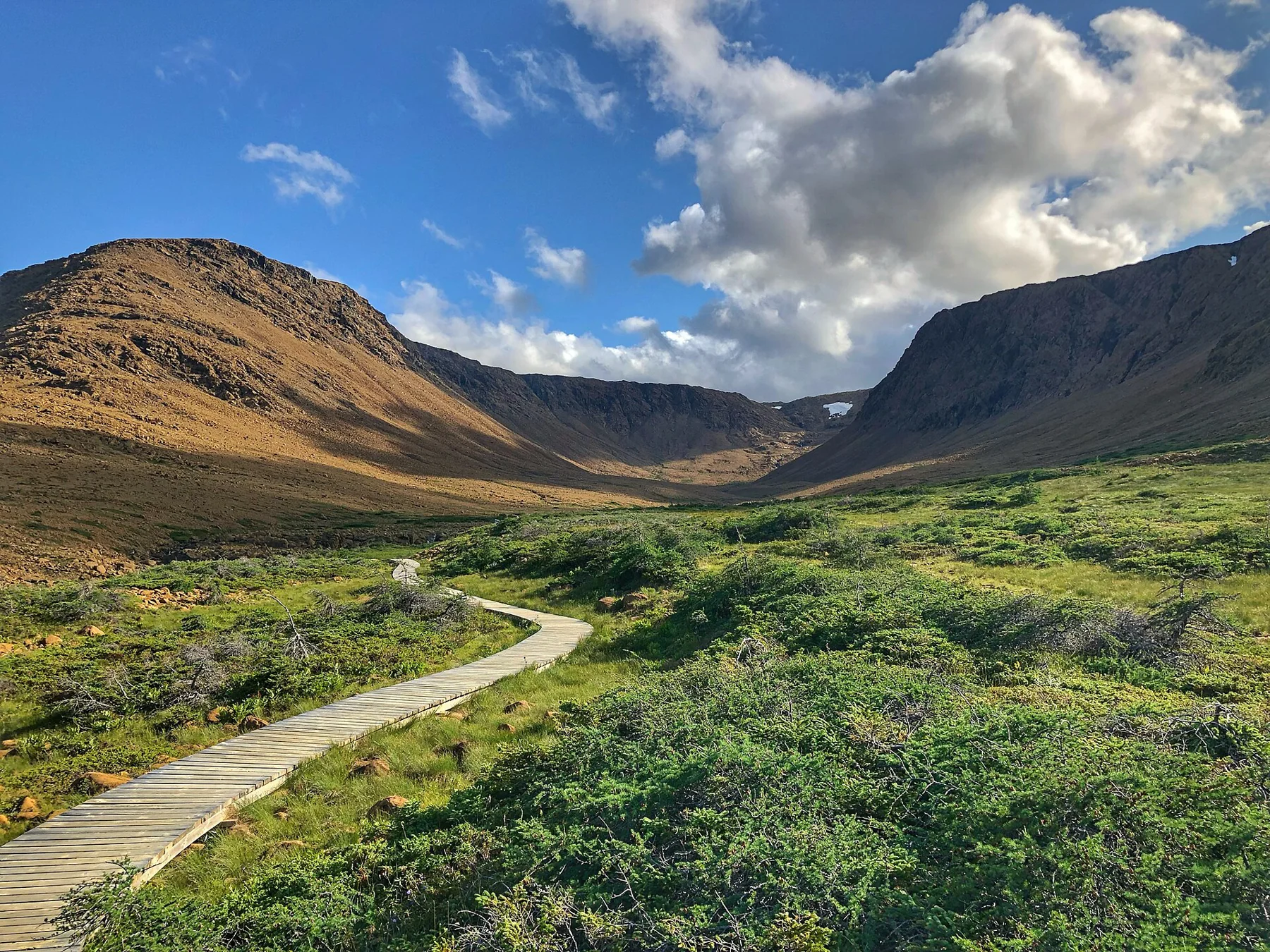 A boardwalk leads into the Tablelands in Gros Morne National Park.